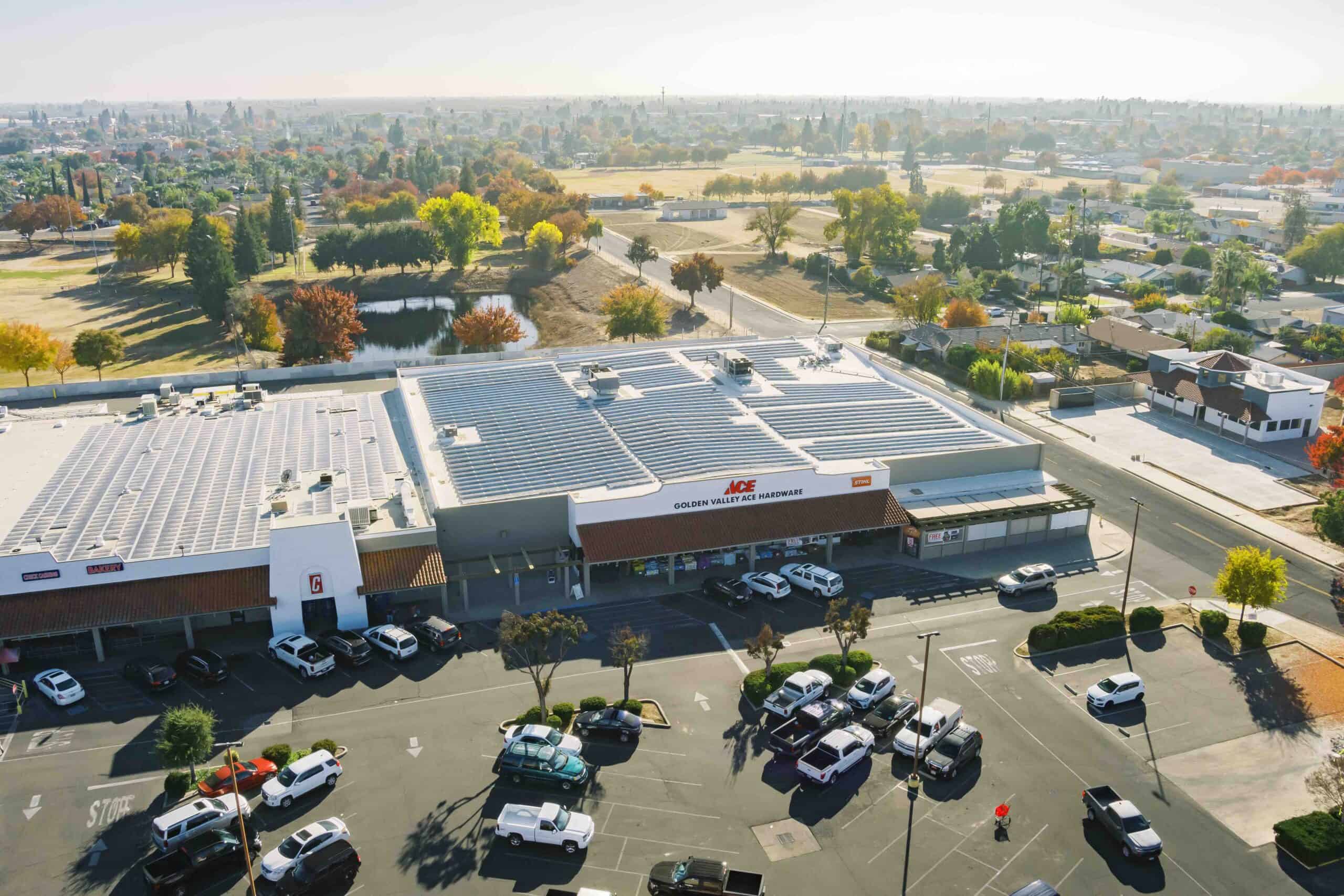 Neighborhood Shopping Center Solar - King Energy a large solar array on the rooftop of a neighborhood shopping center